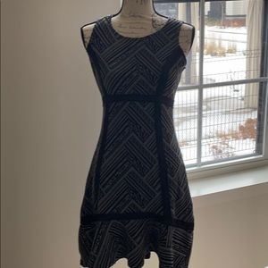 High-waist sleeveless sweater dress with ruffle